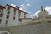 Ladakh - Lamayuru Gompa, the main monastery with the characteristc red painted windows on white washed faade 